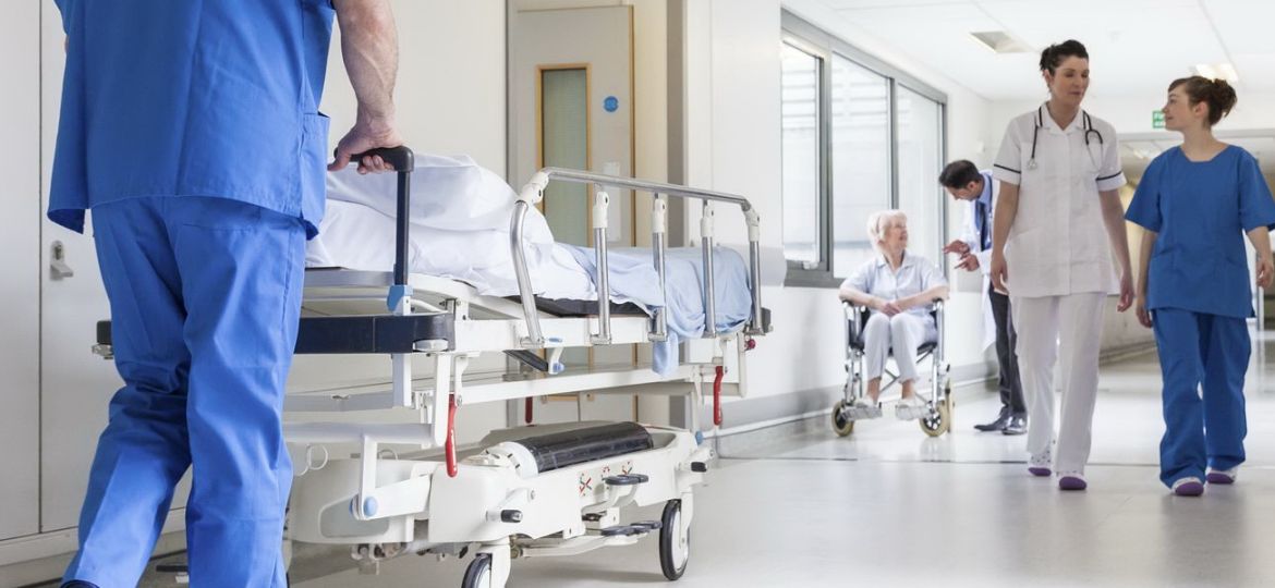 Doctors Hospital Corridor Nurse Pushing Gurney Stretcher Bed